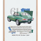 Oak-framed art print featuring a green 1961 Jaguar E-Type collage and descriptive text.