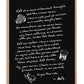 Oak-framed black artwork with handwritten dining reflections and drawings of steak, a drink, and an oyster.