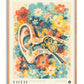 Oak-framed Auris in Bloom art print featuring a stylized ear surrounded by colorful flowers.