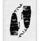 White-framed abstract art print with two textured black forms, curling lines, and ink drips on white.