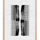 Oak-framed black abstract comb artwork on a textured white background.