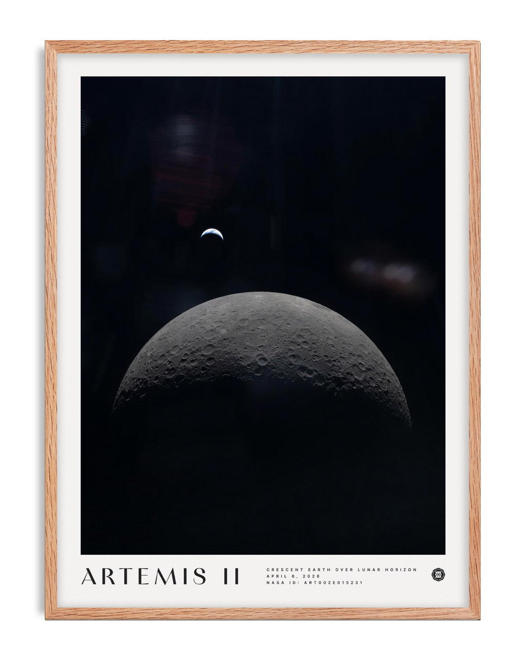 Oak-framed Artemis II art print showing a crescent Earth above the cratered lunar horizon.
