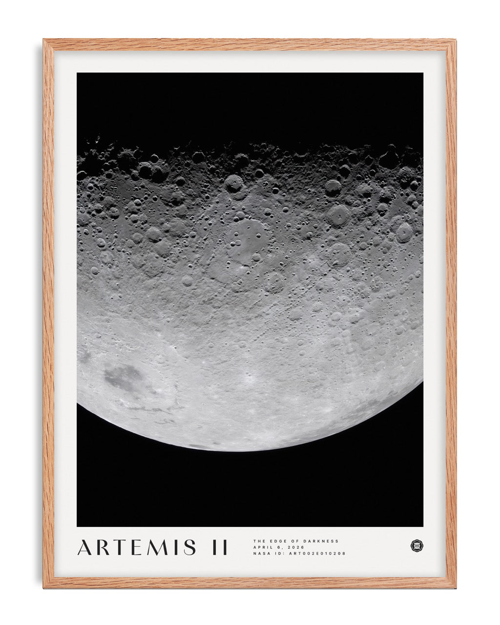 Oak-framed Artemis II art print featuring a detailed cratered lunar surface against black space.