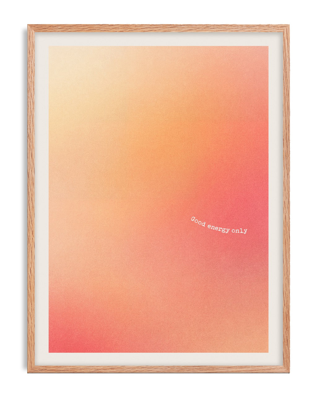 Oak-framed abstract art print with a peach-to-coral gradient and the white text “Good energy only.”