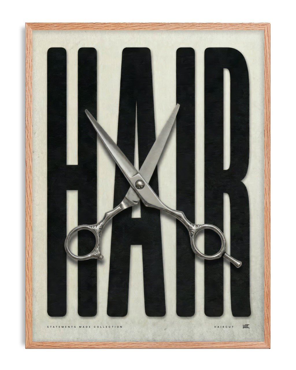 Oak-framed HAIR artwork with oversized black lettering and open silver haircutting scissors.