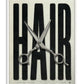 White-framed HAIR artwork with oversized black lettering and open silver haircutting scissors.