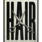 Black-framed HAIR artwork with oversized black lettering and silver haircutting scissors.
