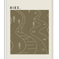 White-framed HIKE. artwork with white winding trails, streams, trees, rocks, and map symbols on olive green.