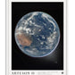 White-framed Artemis II art print showing Earth against black space, with Australia visible beneath swirling clouds.
