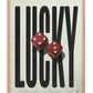 Oak-framed LUCKY artwork featuring tall black lettering and two red dice.