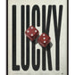 Black-framed LUCKY art print featuring oversized black lettering and two glossy red dice.