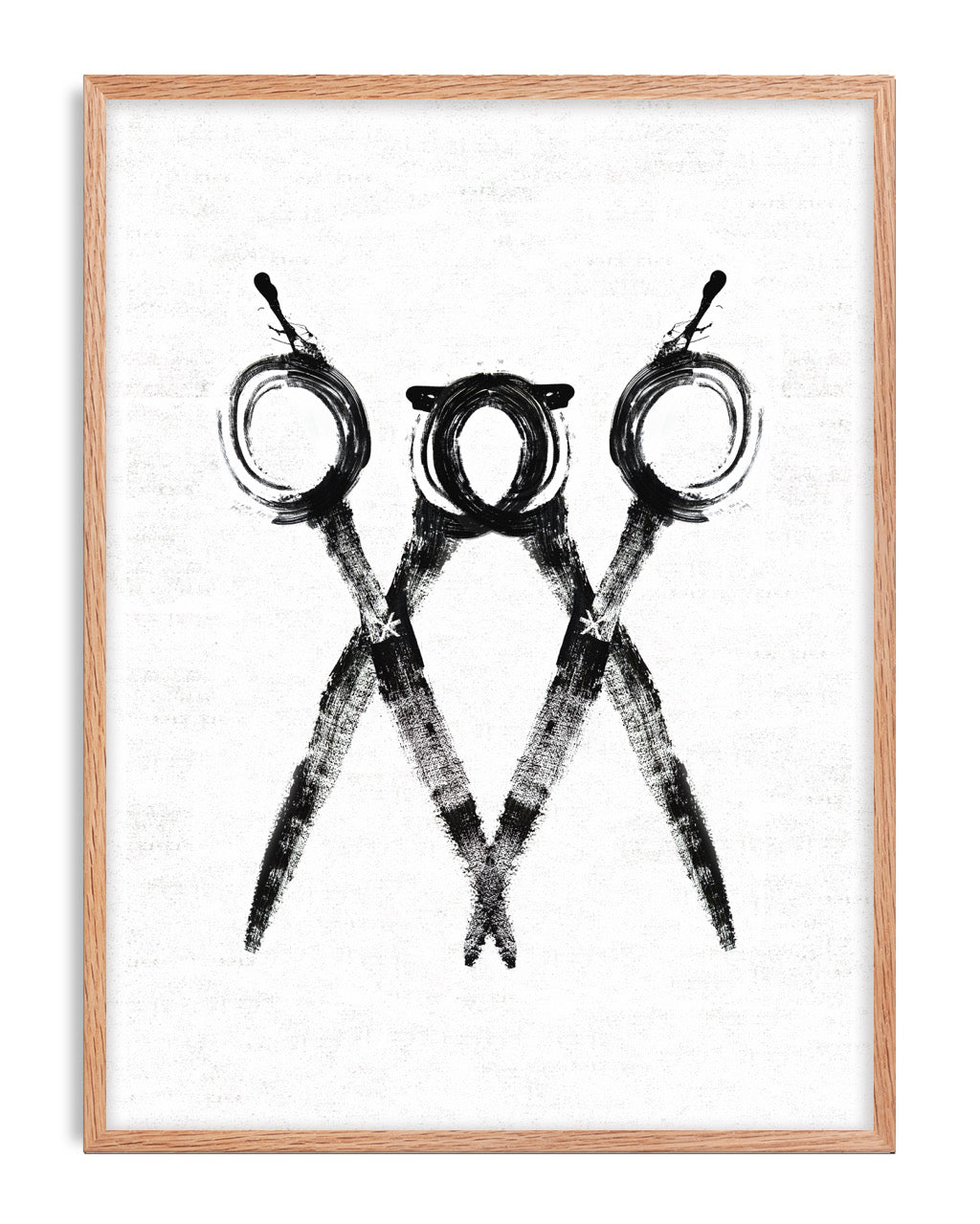 Oak-framed monochrome artwork of three overlapping scissors with circular handles.