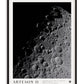 Black-framed Artemis II Shadows at the Edge of Lunar Day art print showing cratered terrain emerging from deep shadow.