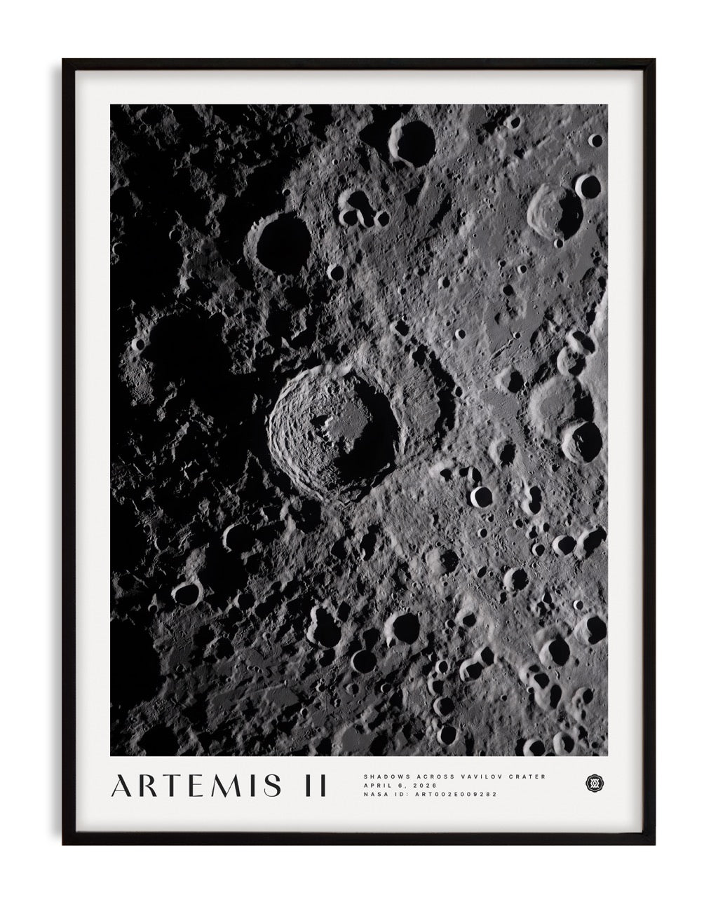 Black-framed Artemis II Shadows Across Vavilov Crater art print featuring a high-contrast view of the cratered lunar surface.