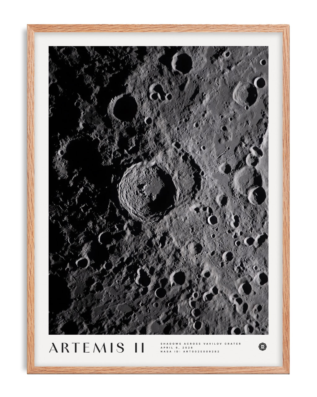 Oak-framed Artemis II Shadows Across Vavilov Crater art print featuring a high-contrast view of the cratered lunar surface.