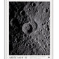 White-framed Artemis II Shadows Across Vavilov Crater art print featuring a high-contrast view of the cratered lunar surface.
