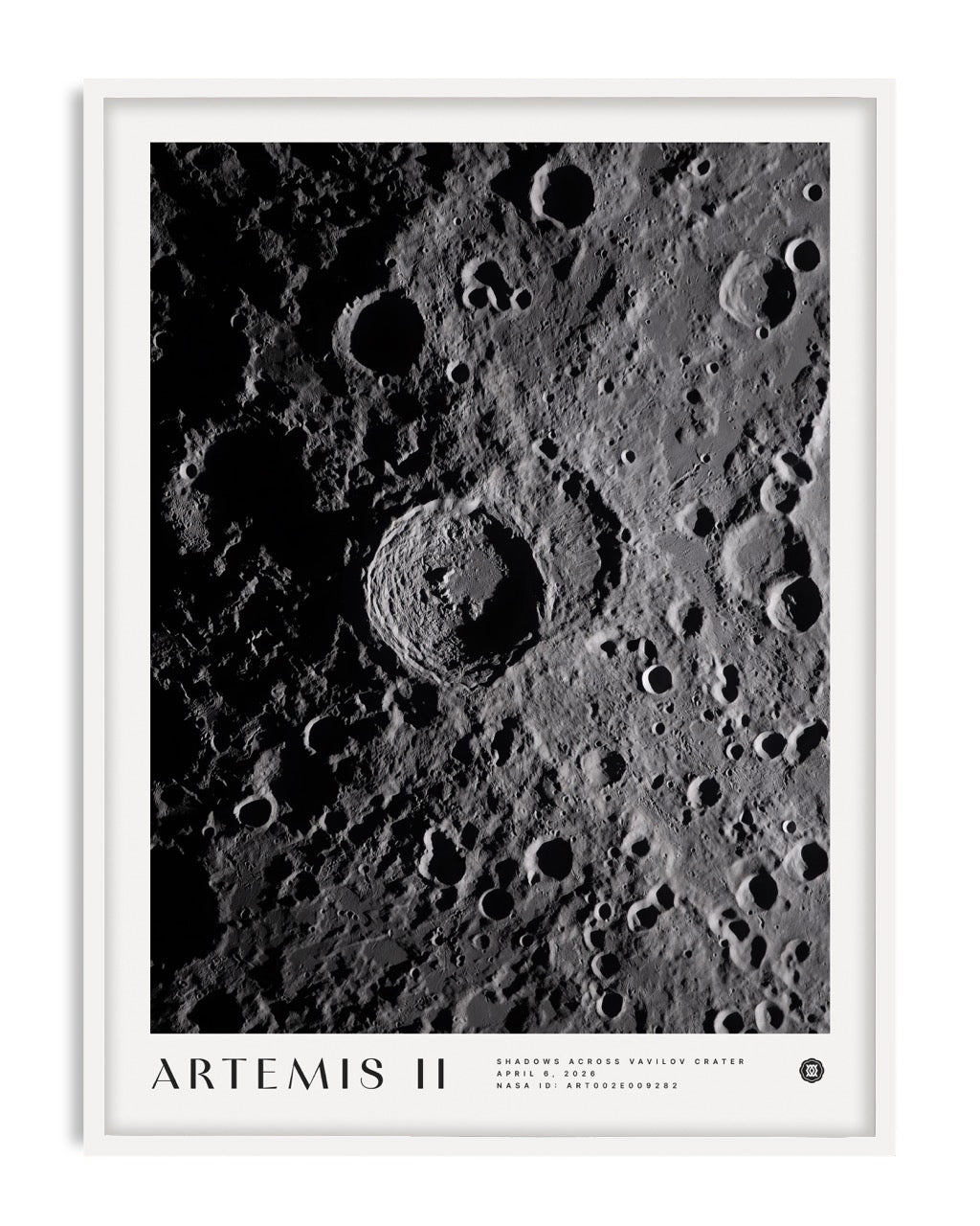 White-framed Artemis II Shadows Across Vavilov Crater art print featuring a high-contrast view of the cratered lunar surface.