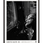 Black-framed Artemis II art print showing a black-and-white portrait of an astronaut wearing a headset and looking through a spacecraft window.
