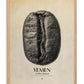 Oak-framed Yemen Mokha Haraaz art print featuring an oversized black coffee bean with fine map outlines on a warm cream background.