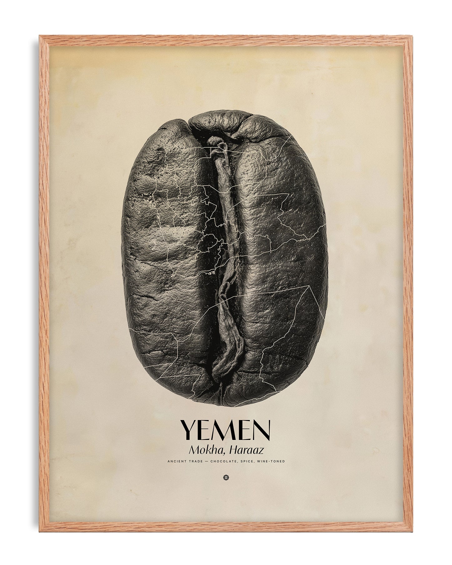 Oak-framed Yemen Mokha Haraaz art print featuring an oversized black coffee bean with fine map outlines on a warm cream background.