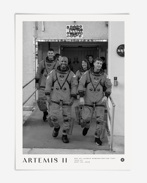 Unframed Artemis II crew art print featuring four astronauts in spacesuits walking out of a NASA building.