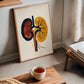 framed abstract art print of a human kidneys in a modern home office