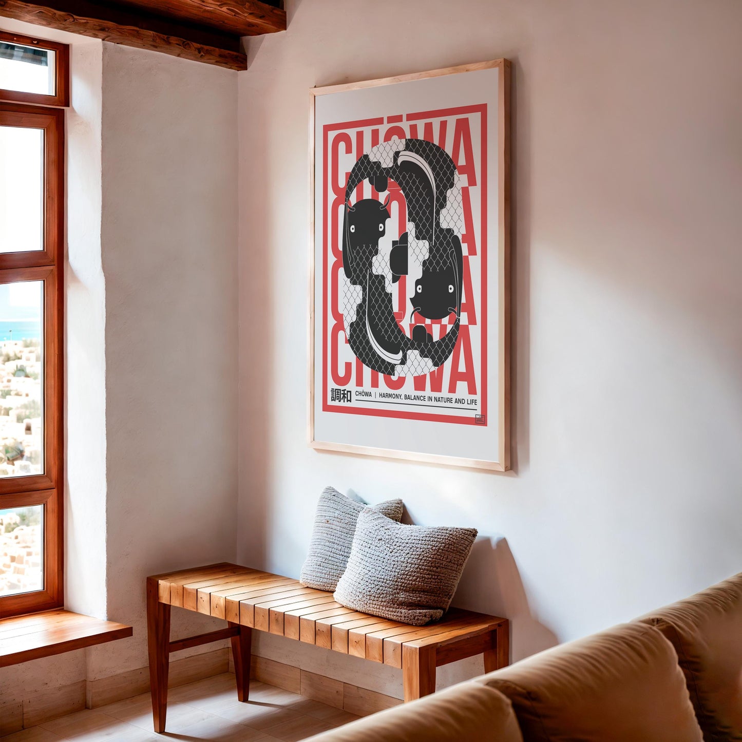 Japanese-inspired Chōwa art print showing black koi fish in a balanced circular form, on beach house wall