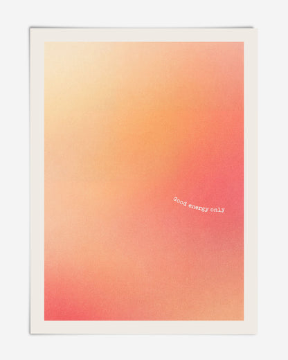 Unframed abstract art print with a soft peach, coral, and red gradient and the white text “Good energy only.”