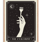 Oak-framed The Colorist art print with a hand holding a hair-coloring brush against a starry black background.