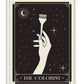 White-framed The Colorist art print featuring a hand holding a hair-coloring brush among stars and a crescent moon.