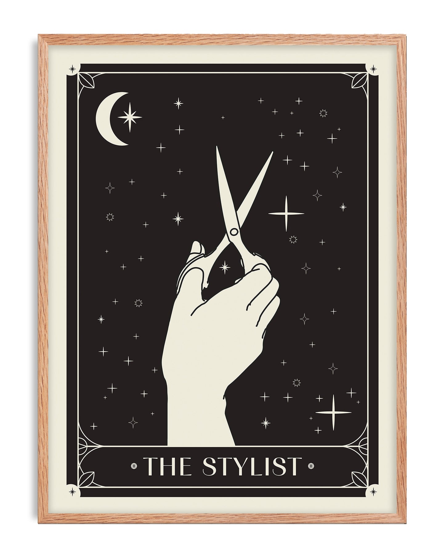 Oak-framed The Stylist art print with a hand holding scissors against a celestial black background.