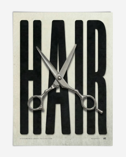 Unframed HAIR art print with oversized black lettering and open silver haircutting scissors.