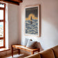 Oak-framed Sacred Lineup Oahu Hawaii artwork hanging above a wooden bench in a sunlit living room.