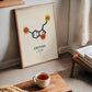 Oak-framed Serotonin molecule artwork displayed in an interior setting.