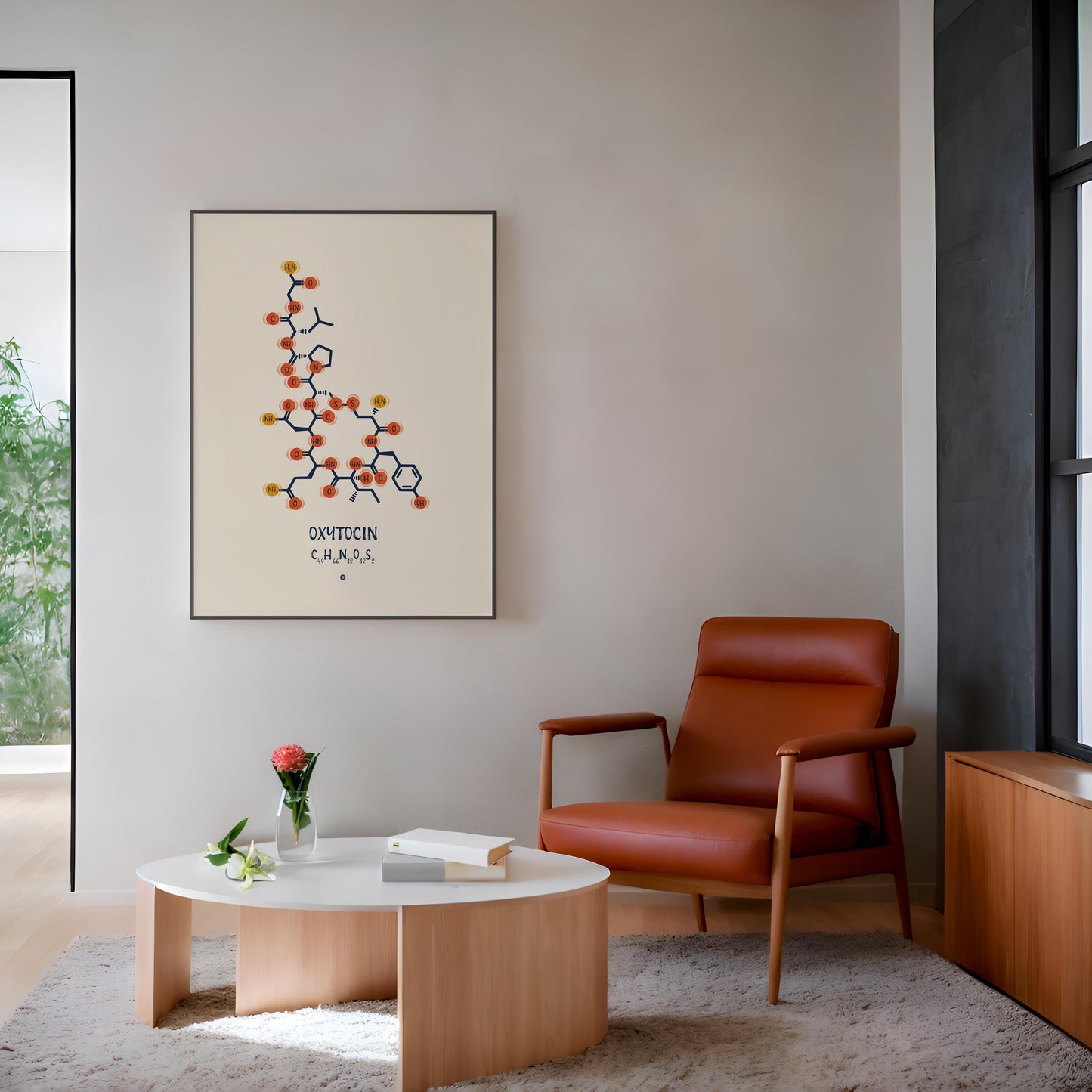 Black-framed oxytocin molecular artwork displayed above a rust-colored armchair in a modern living room.
