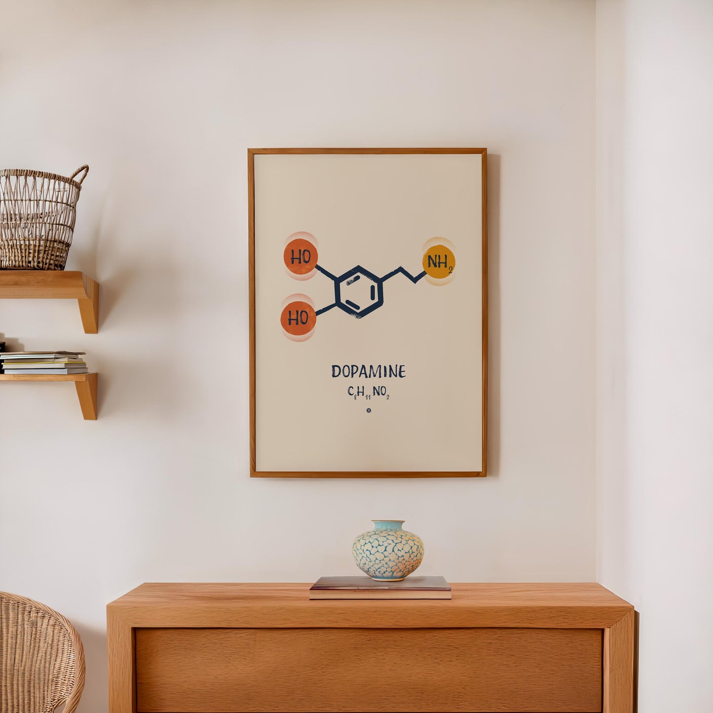 Oak-framed dopamine molecular artwork displayed above a wooden cabinet with a ceramic vase.