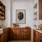 Framed Panama Boquete coffee bean art print displayed above wood cabinetry in a kitchen.