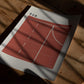 Unframed Run track art print lying on a wooden table beneath dramatic window shadows.