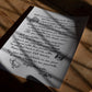 Unframed handwritten dining advice art print with steak, drink, and oyster drawings on a sunlit wooden table.