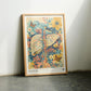 Oak-framed Hepar in Bloom artwork leaning on a dark floor between two chairs.