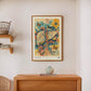 Dark wood-framed Hepar in Bloom artwork displayed above a wooden console with a ceramic vase.