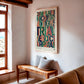 Oak-framed colorful legal-themed artwork hanging above a wooden bench in a bright room with exposed ceiling beams.