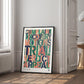 Black-framed colorful legal-themed artwork leaning against the wall in a bright paneled room.
