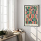 Black-framed colorful medical process typography artwork displayed on a sunlit wall beside a window seat.