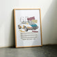 Oak-framed 1965 Porsche 911 collage artwork leaning against a pale wall between two chairs.