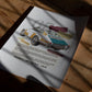 Unframed 1965 Porsche 911 collage art print with teal and mustard panels lying in patterned sunlight on a wooden table.