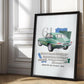 Black-framed 1961 Jaguar E-Type collage artwork leaning against an ornate white paneled wall in sunlight.