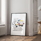 Black-framed 1985 Lamborghini Countach artwork leaning against a wall in a bright interior.