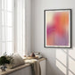 Black-framed “This is my happy place” gradient art print displayed in a bright bedroom beside tall windows.