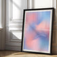 Black-framed pink and blue gradient art print reading “The only way out is through,” leaning in a sunlit paneled room.